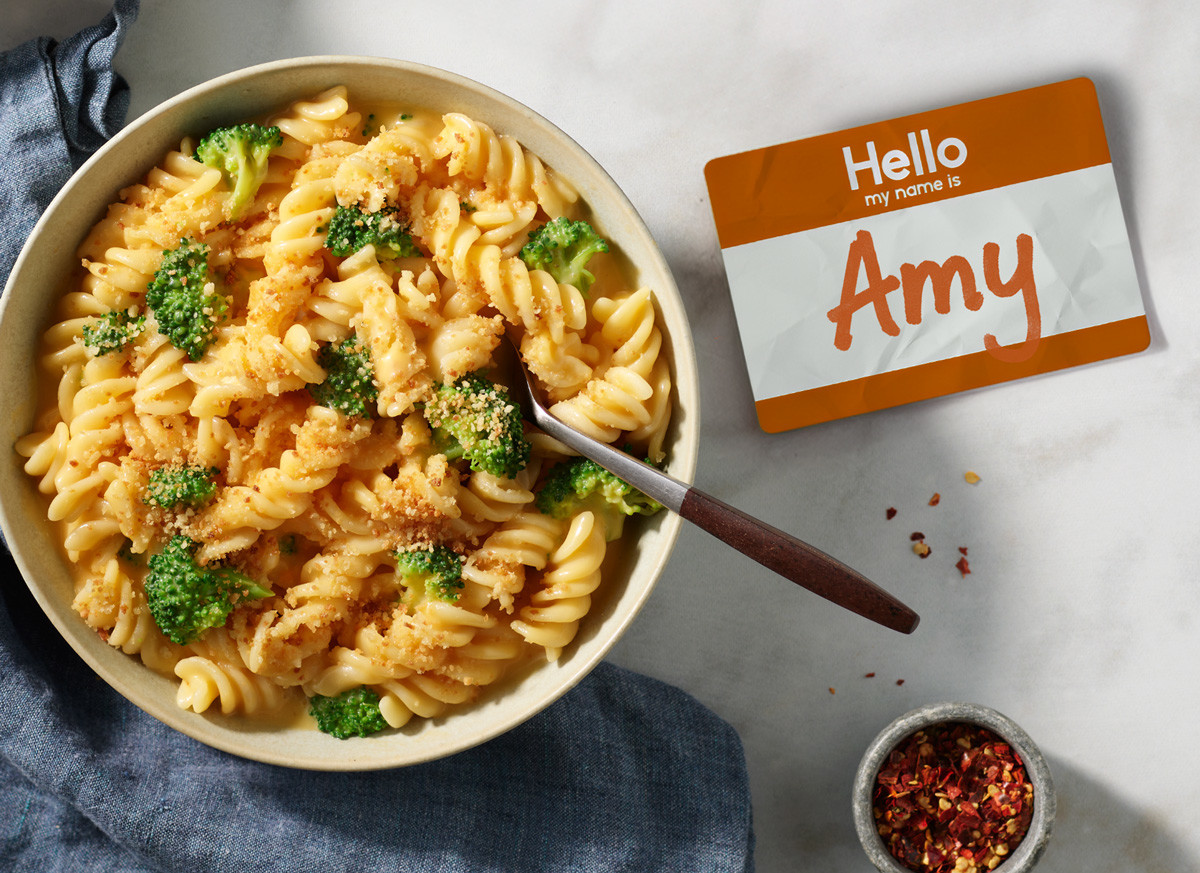 A bowl of Amy's Broccoli Cheddar Bake and a name tag that reads, 'Hello, my name is Amy'